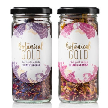 2 glass jars of Botanical Gold 24 carat gold edible flower garnish side by side - indigo purple flower jar and blush rose flower jar