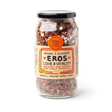 400g Glass jar showing contents of the Mindful Foods Organic & Activated Eros Love & Vitality Granola. Label shows ingredients of pomegranate, rose, macadamia, pecan, vanilla, pepitas & more.  Label also describes granola as gluten free and vegan, to be used as a granola, as smoothie topper or snack